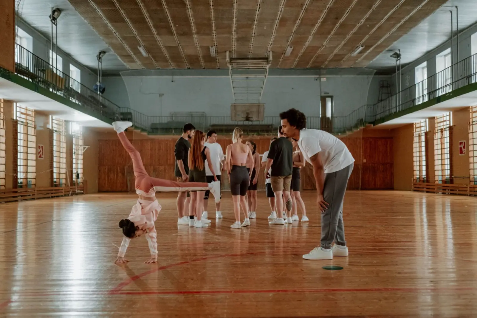 A group warming up in a sports hall